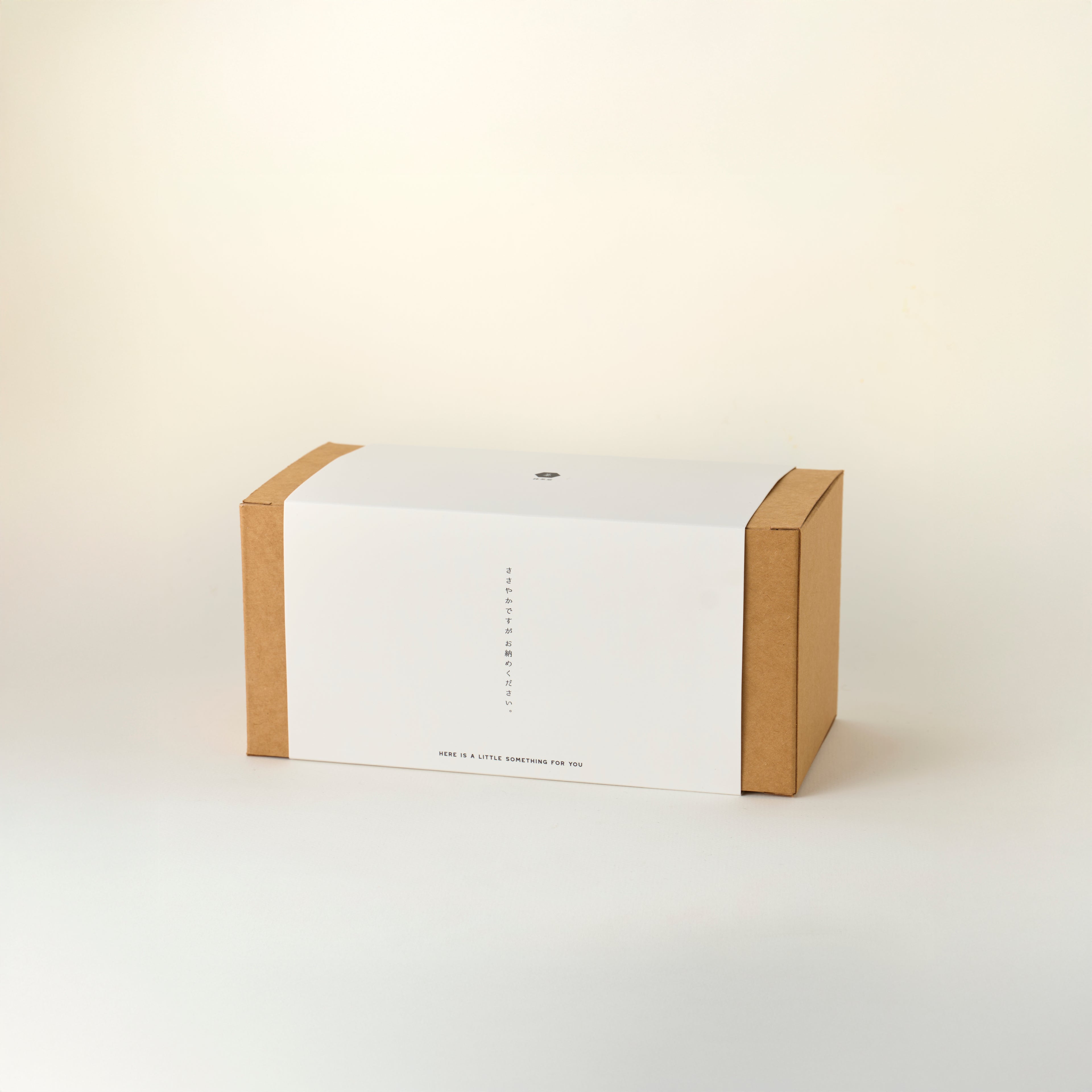 MATCHADO afternoon tea set. White box with brown cardboard flaps on a light beige background