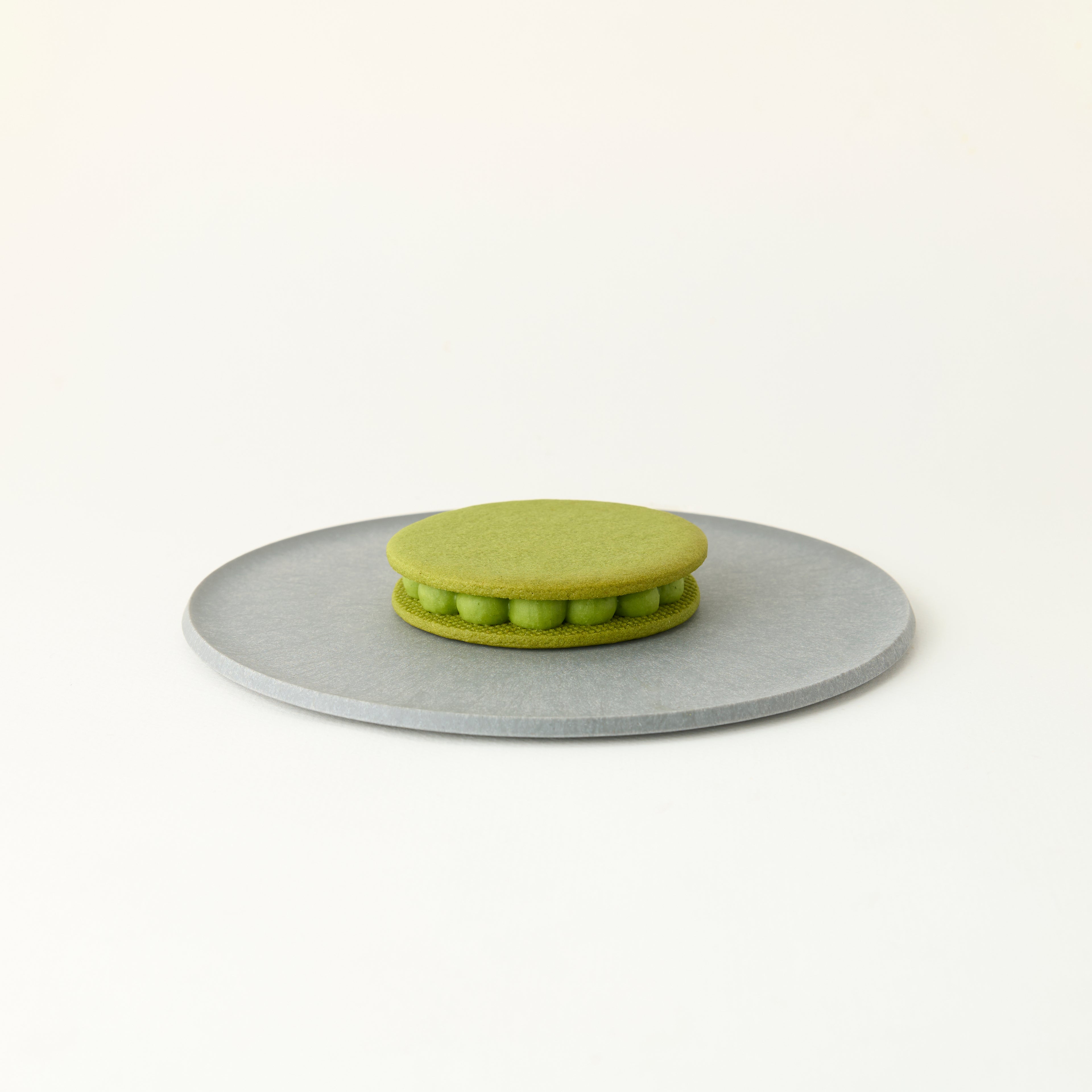 Matcha cookie with a gray base on a white background