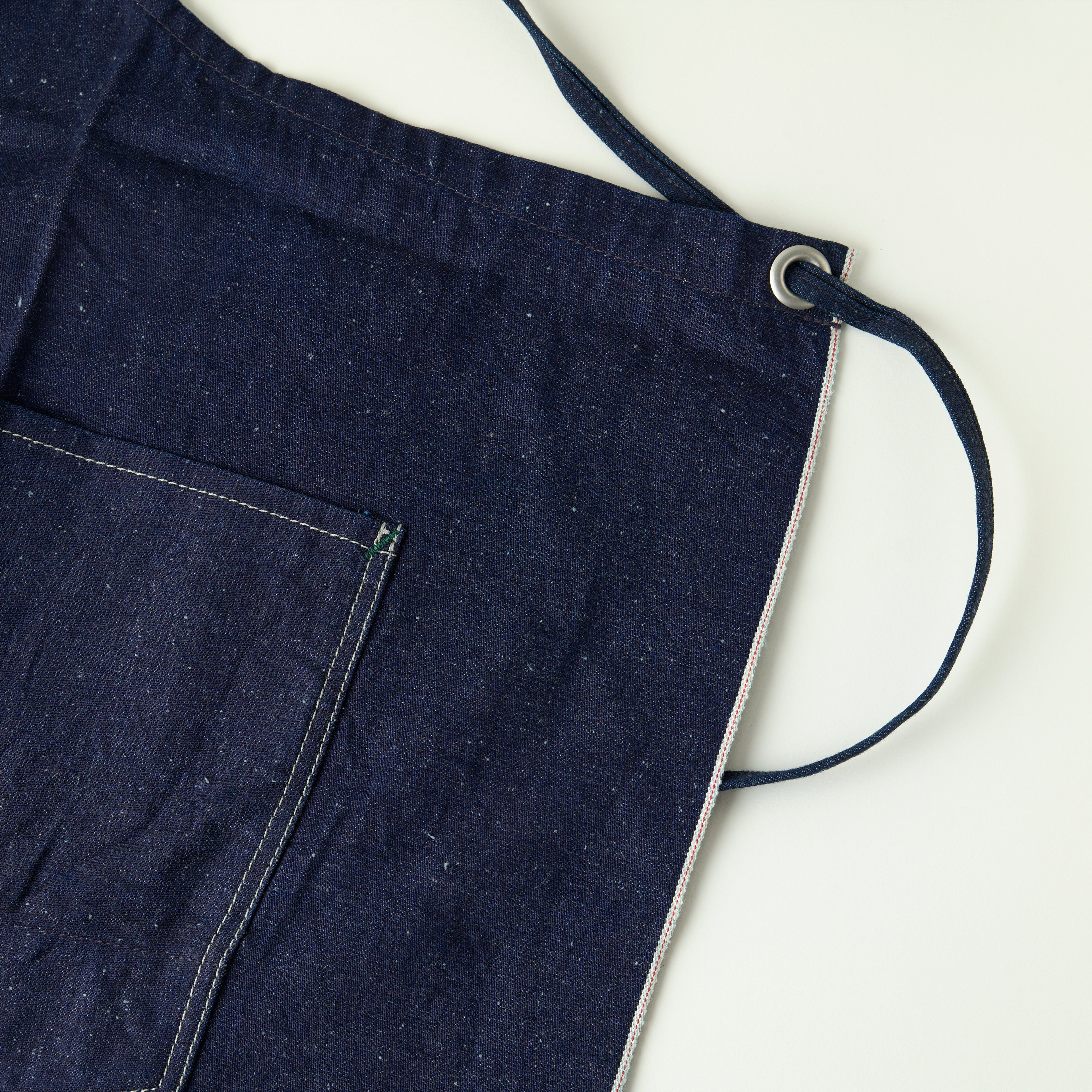 Navy apron with a strap on a white background