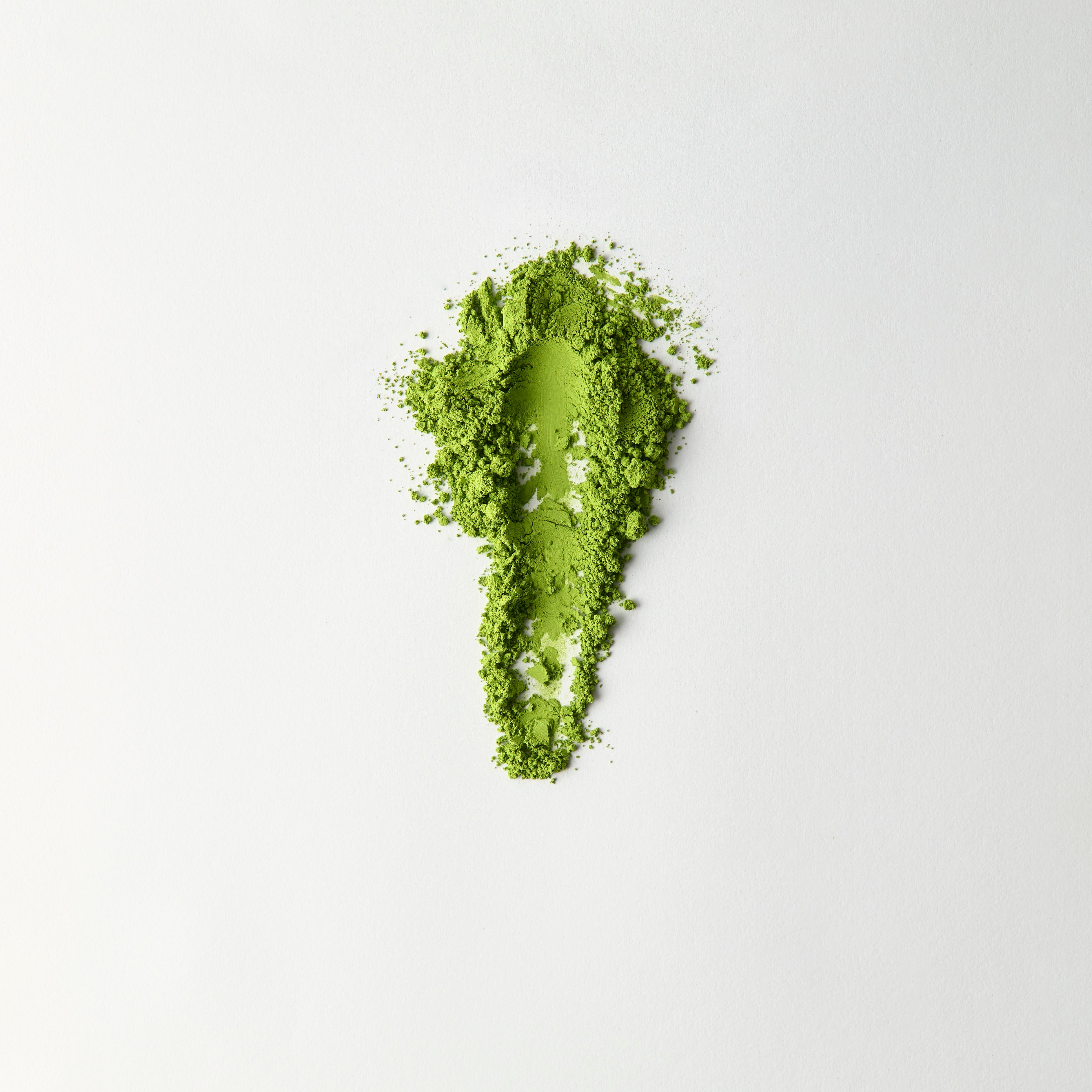MATCHADO Kyoto Saemidori Unsweetened Matcha (NEW) - Single Origin - Bright Green & Delicate Floral Notes. Matcha powder shaped like a footprint on a white background