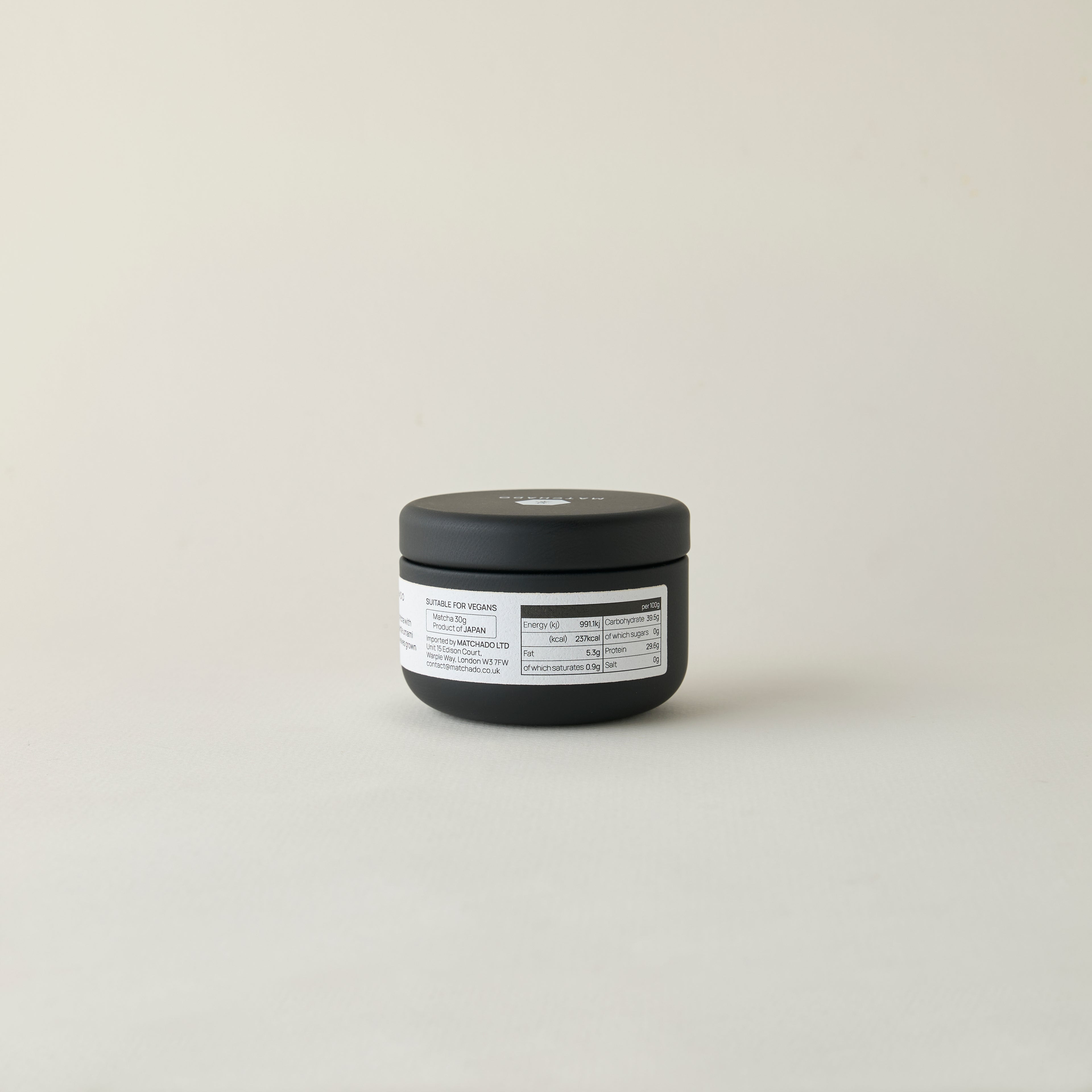 MATCHADO Kyoto Saemidori Unsweetened Matcha (NEW) - Single Origin - Bright Green & Delicate Floral Notes. Black container with a label on a light gray background