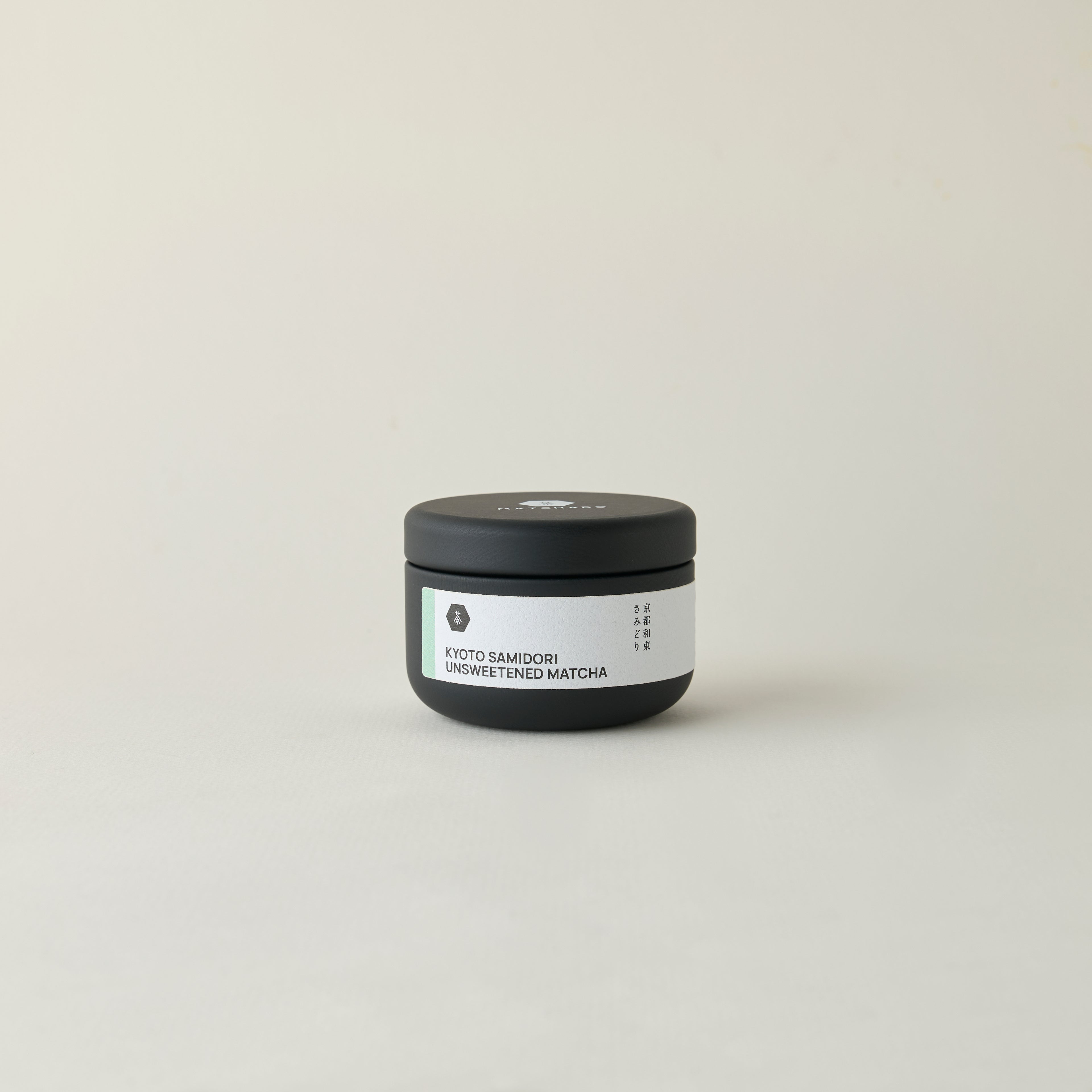 MATCHADO Kyoto Samidori Unsweetened Matcha (NEW) - Single Origin - Refined Aftertaste & Balanced Aroma. Small black container with a white label on a light gray background