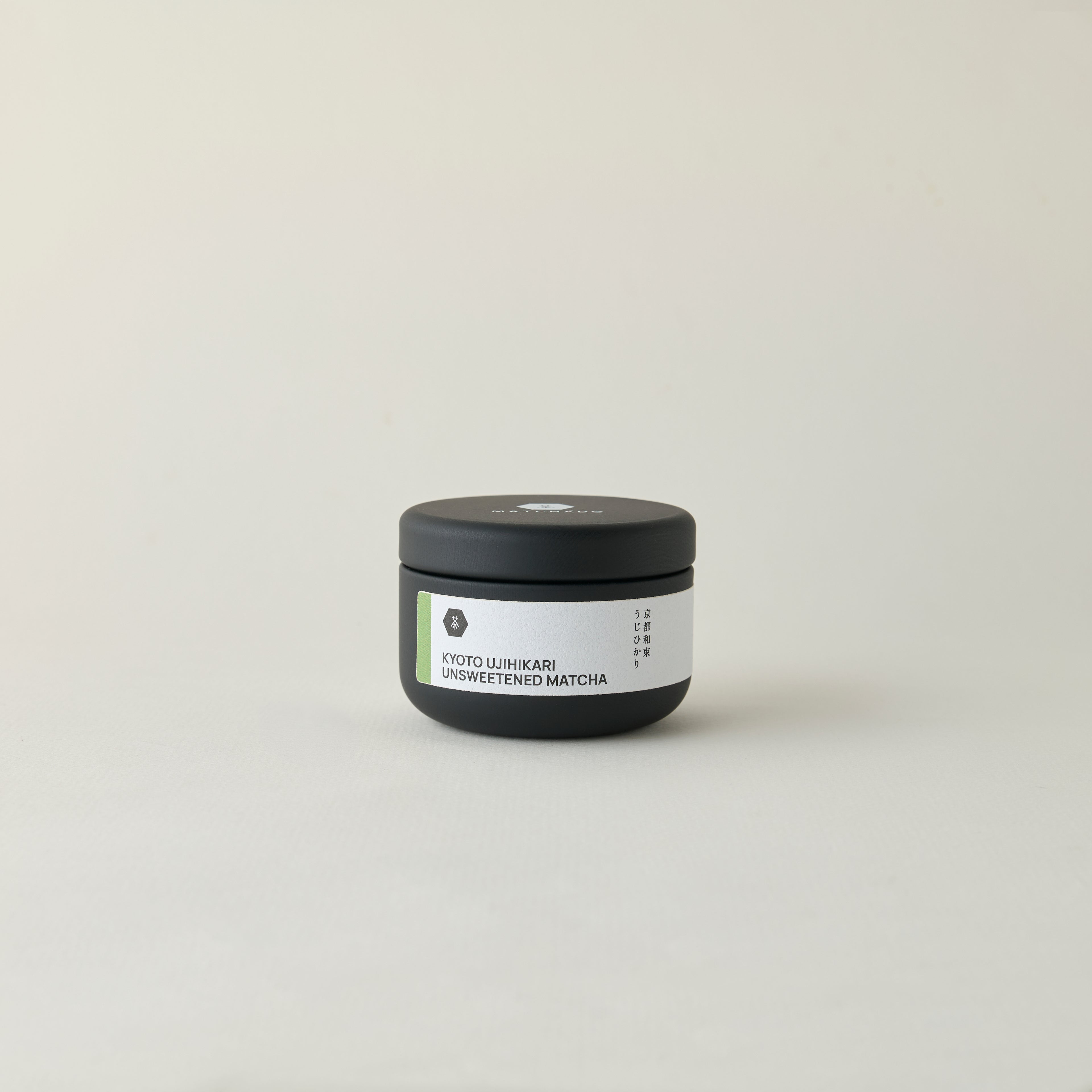MATCHADO Kyoto Ujihikari Unsweetened Matcha (NEW) - Single Origin - Creamy & Subtly Savoury Flavor. Jar of unsweetened matcha on a light gray background