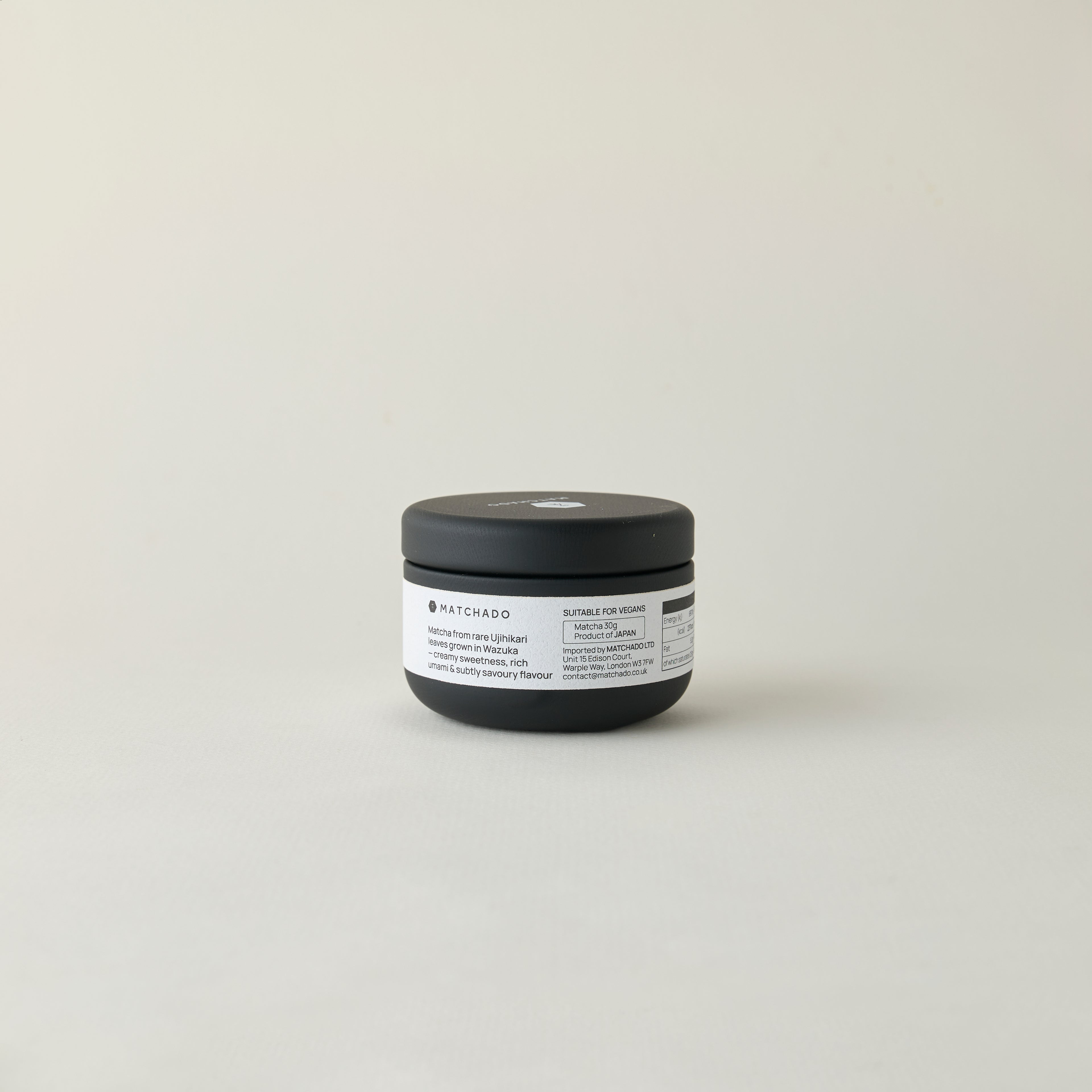 MATCHADO Kyoto Ujihikari Unsweetened Matcha (NEW) - Single Origin - Creamy & Subtly Savoury Flavor. Black jar with a label on a light gray background