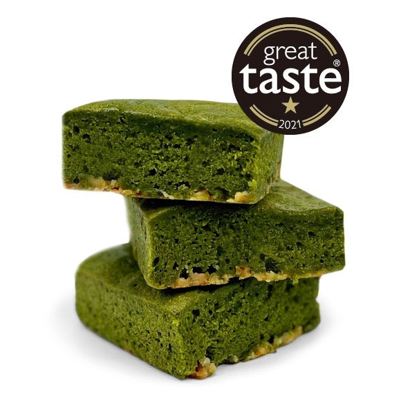MATCHADO Gluten-Free Matcha Brownie – White Chocolate. Stack of three gluten-free white chocolate matcha brownies with the Great Taste 2021 award seal in the top right corner.