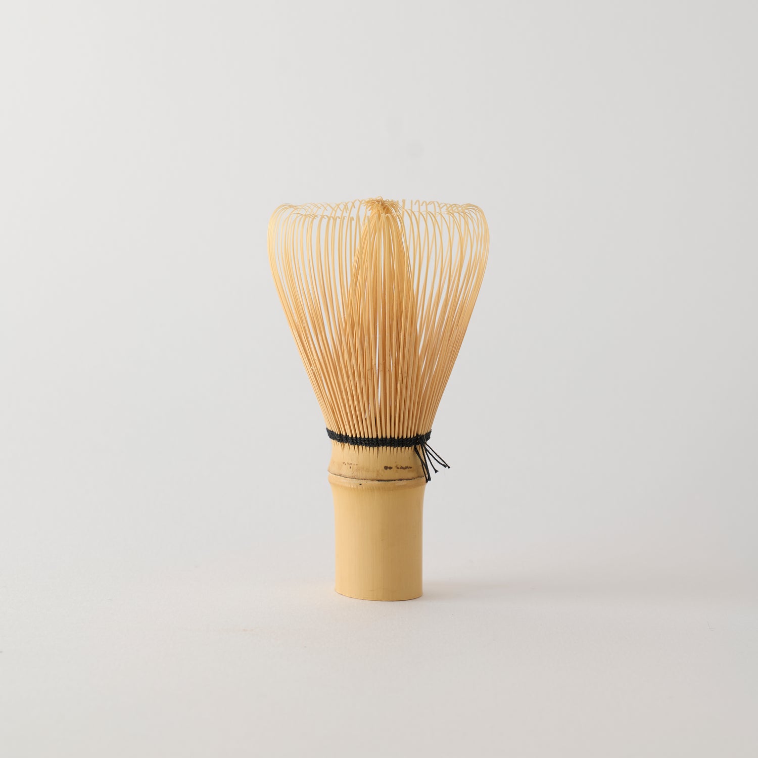 MATCHADO 80-prong Takayama Bamboo Whisk | Hand Made in JAPAN. Bamboo whisk on a light gray background