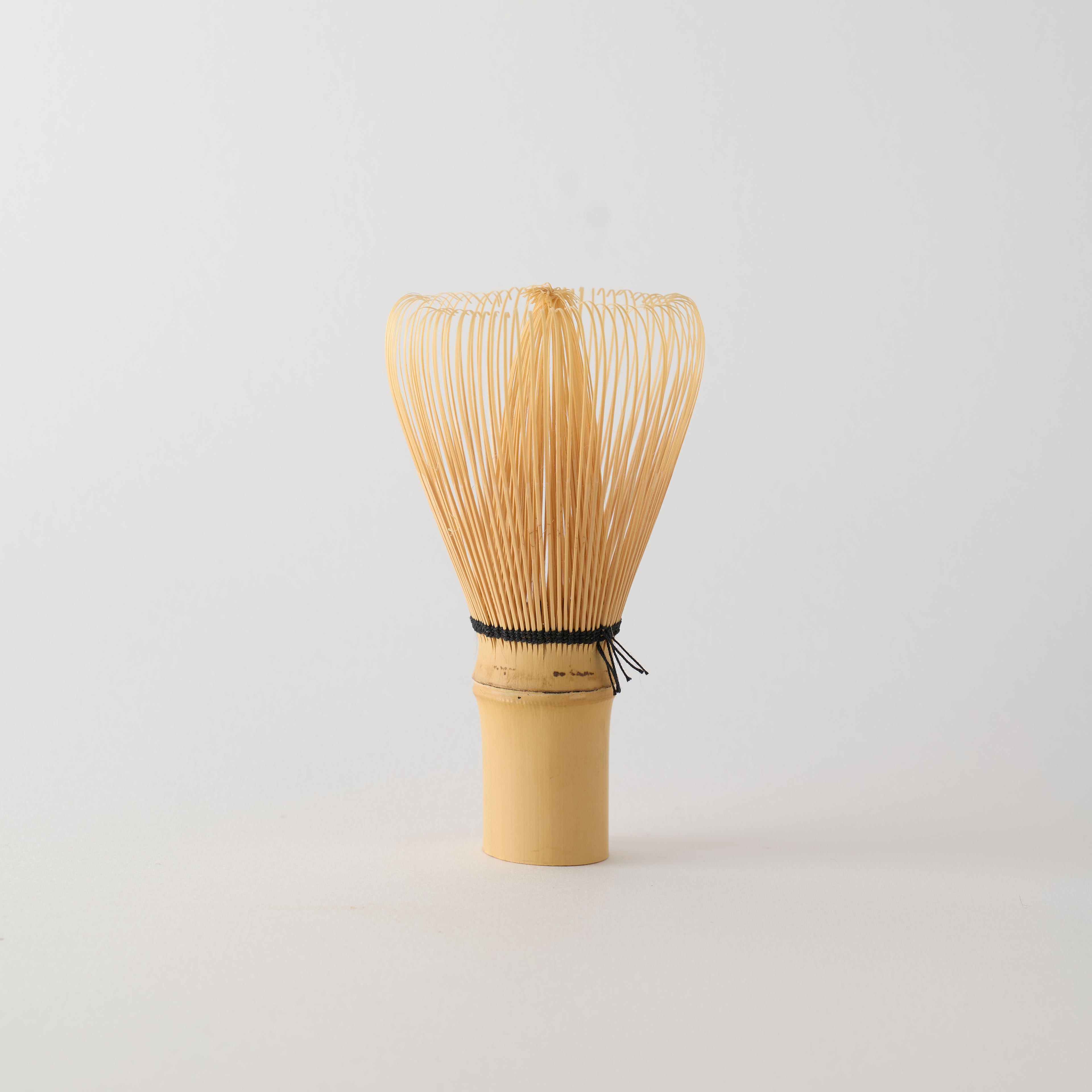 MATCHADO 80-prong Takayama Bamboo Whisk | Hand Made in JAPAN. Bamboo whisk on a light gray background