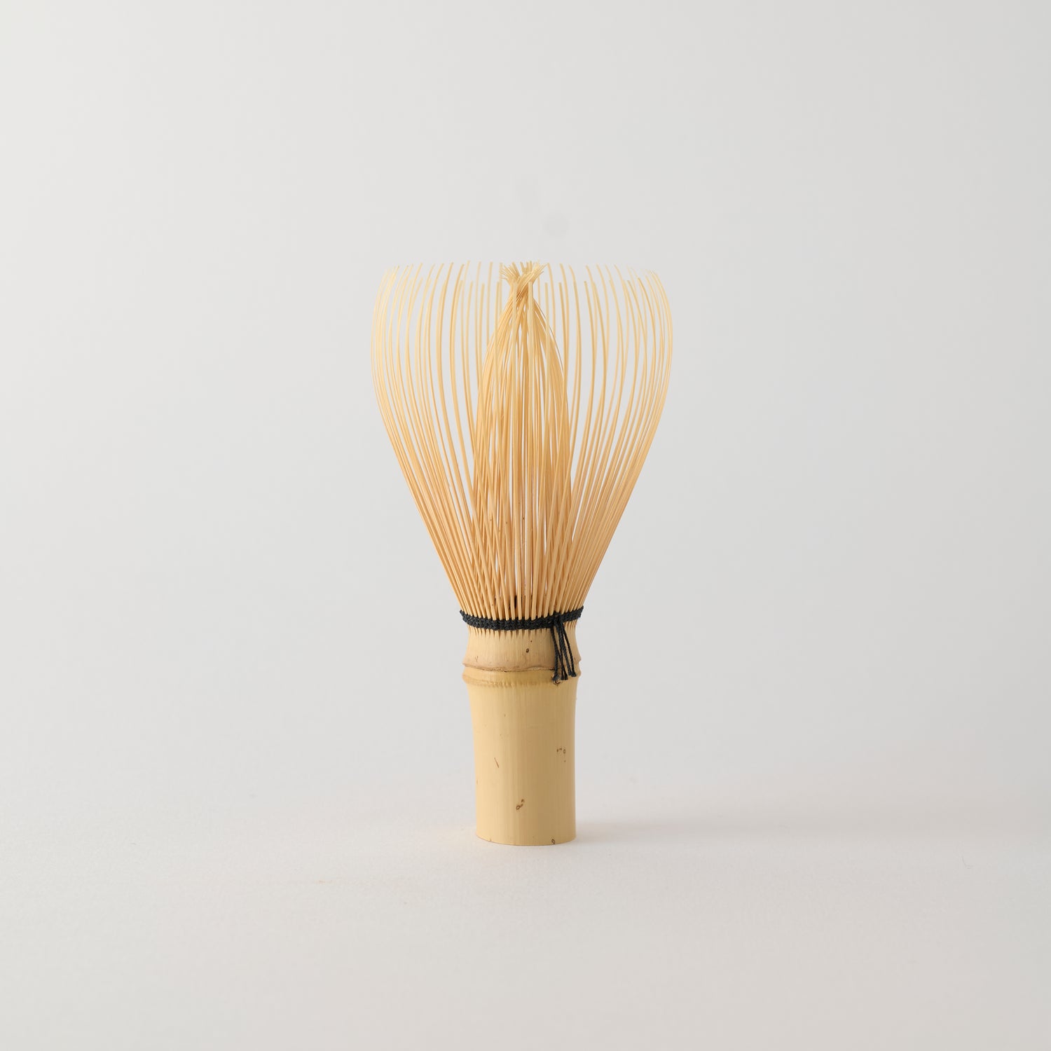 MATCHADO Shin-Kazuho Takayama Bamboo Whisk - Hand Made in JAPAN. Bamboo whisk on a light gray background