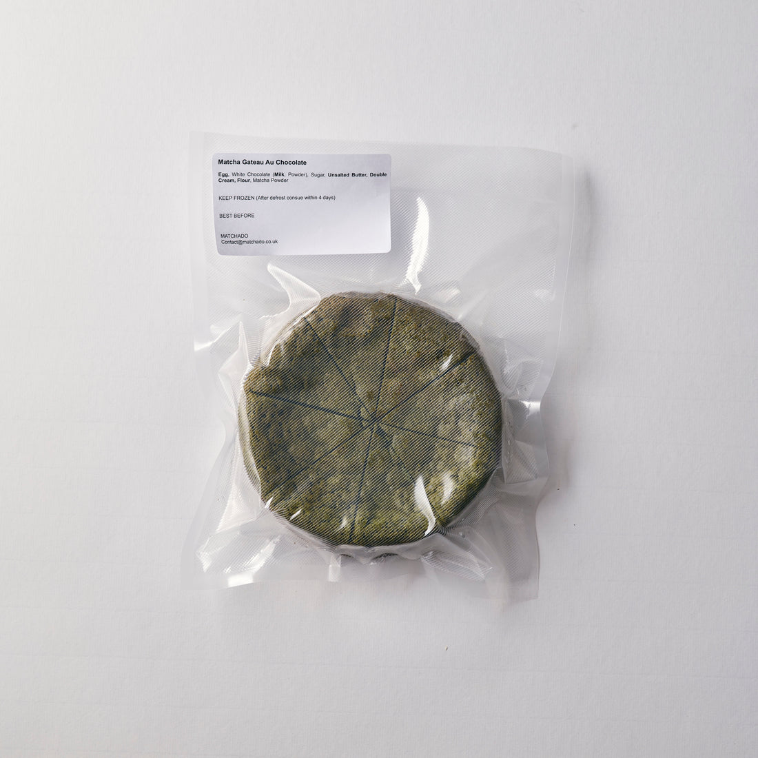 Vacuum-sealed MATCHADO Matcha Gâteau Chocolat showing the product as it arrives. The whole cake is securely packed for freshness.