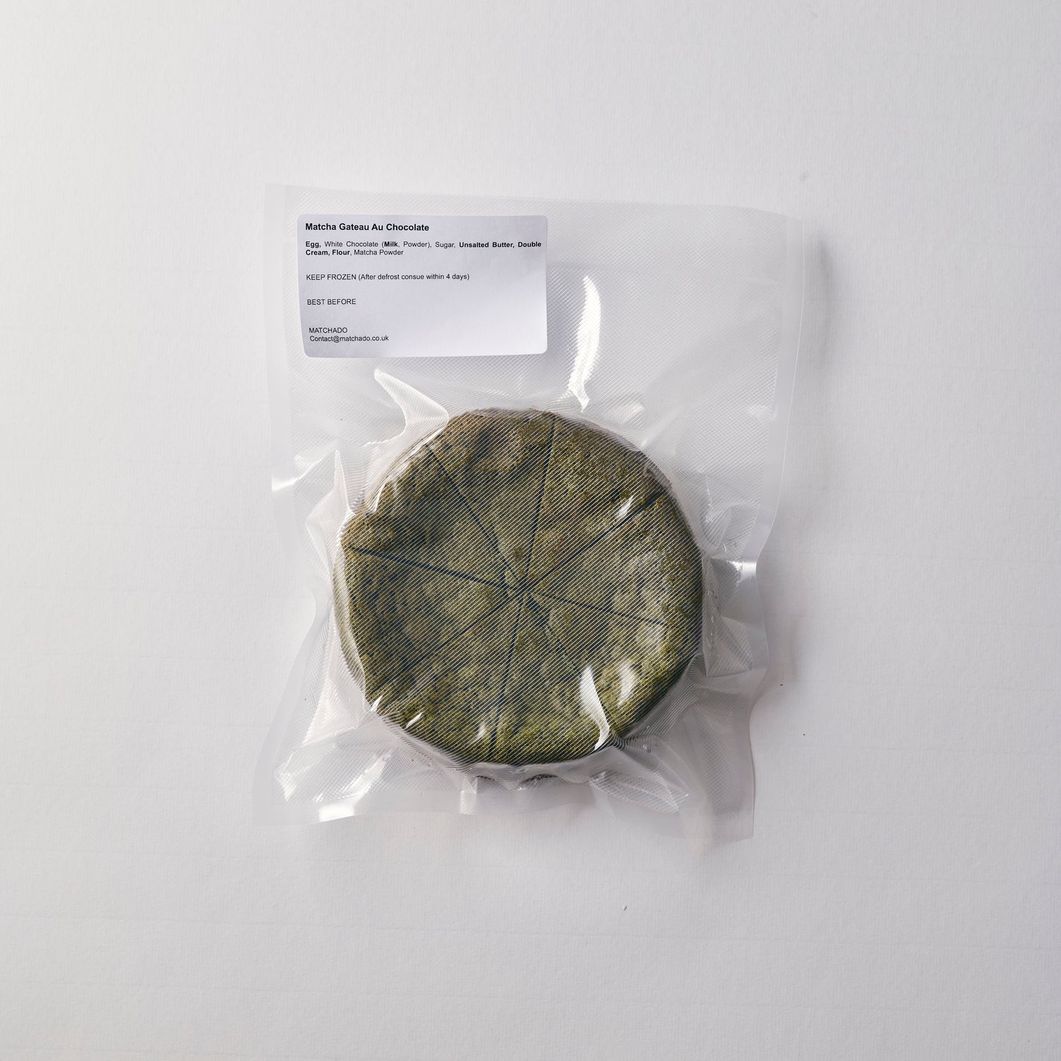 Vacuum-sealed MATCHADO Matcha Gâteau Chocolat showing the product as it arrives. The whole cake is securely packed for freshness.
