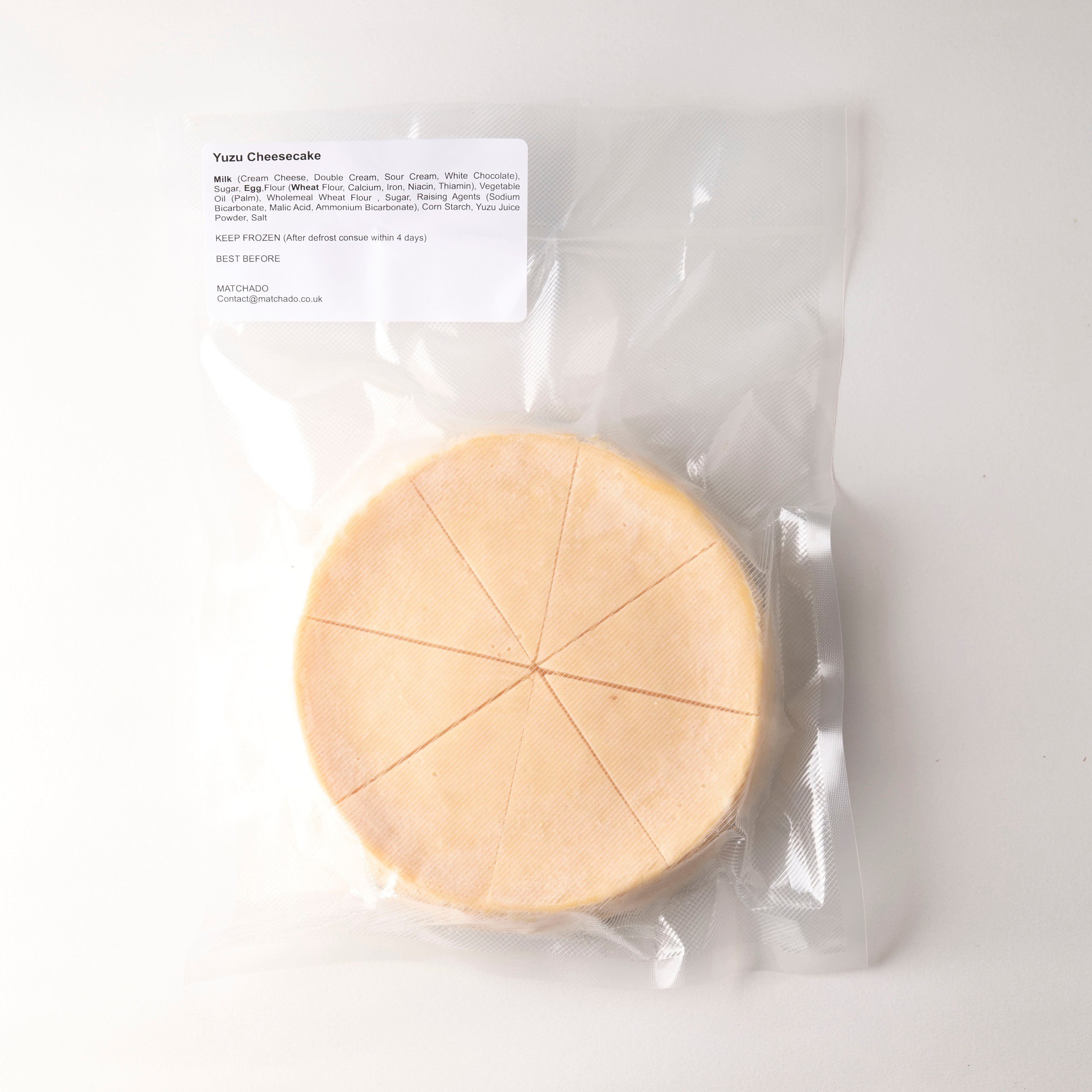 Round cheese wheel with packaging on a white background