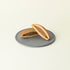 MATCHADO Miffy chocolate Dorayaki - Authentic Japanese Pancake - Fluffy & Sweet Handmade Treat. Two halves of a dorayaki with chocolate filling on a gray plate against a beige background