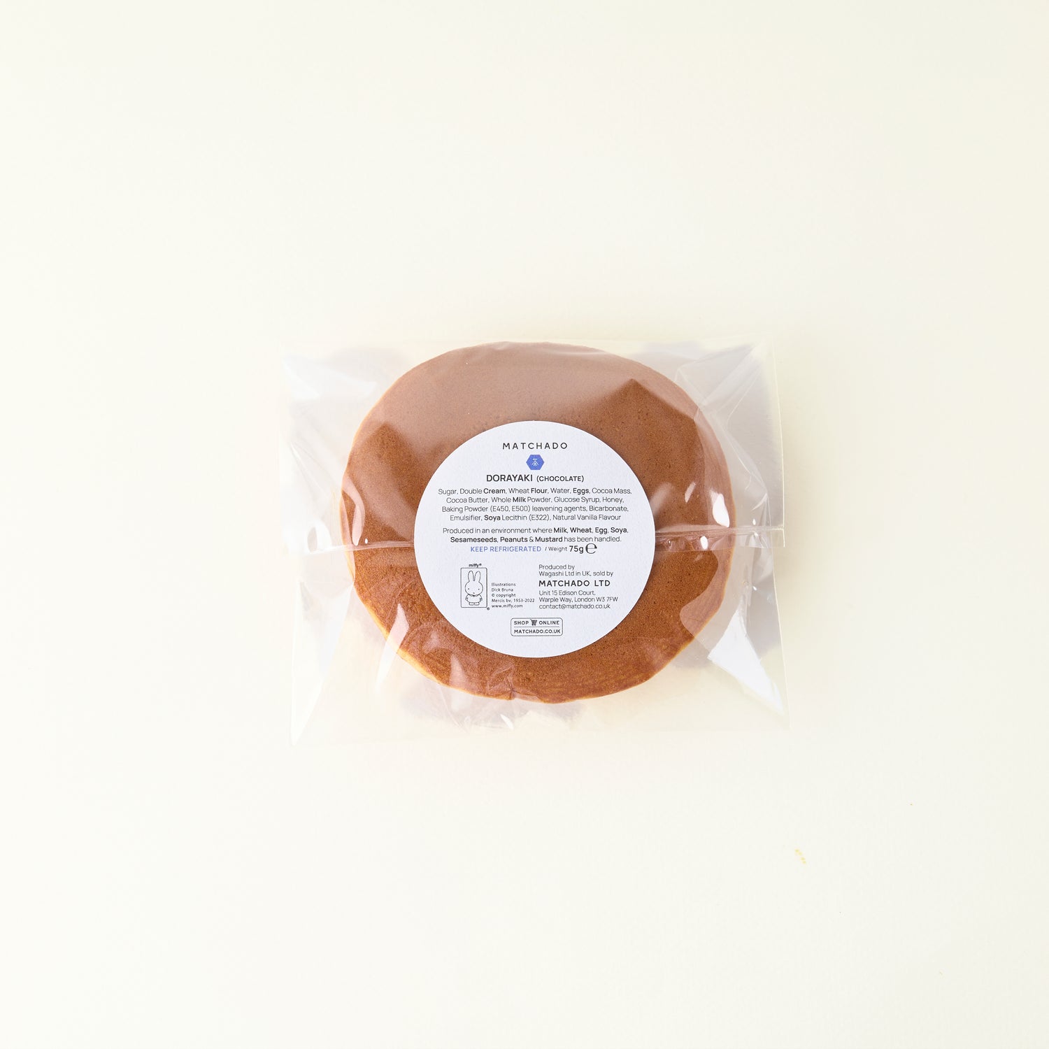 Packaged donut with a label on a white background