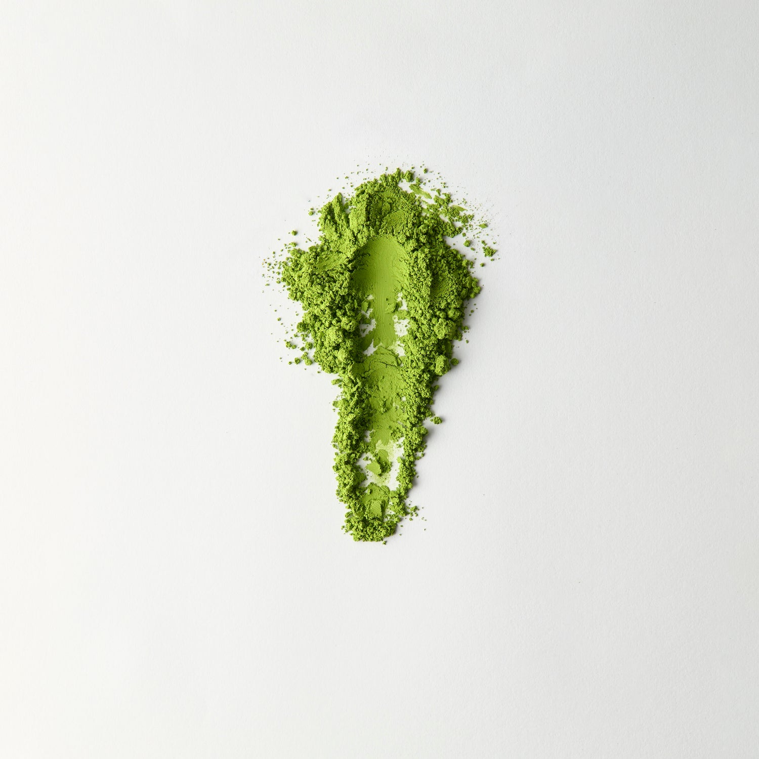 MATCHADO Kyoto Saemidori Unsweetened Matcha (NEW) - Single Origin - Bright Green &amp; Delicate Floral Notes. Matcha powder shaped like a footprint on a white background