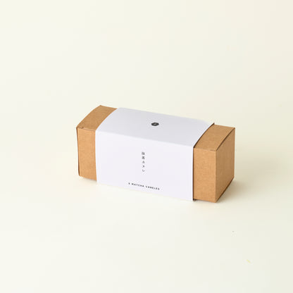 Brown cardboard box with a white label on a beige background