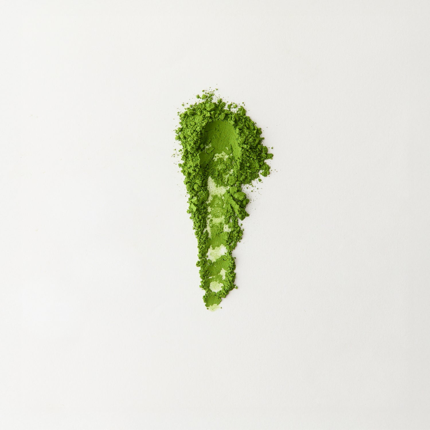 MATCHADO Nagasaki Premium Matcha. Spoonful of green powder on a white background.