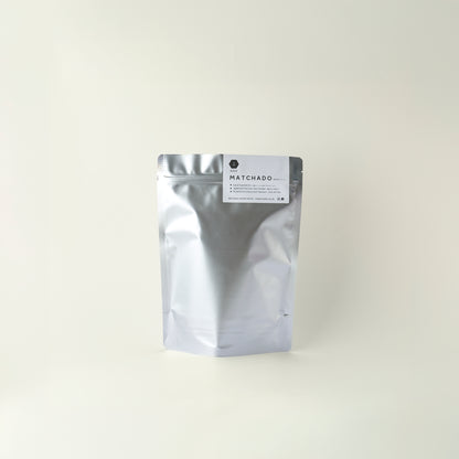 MATCHADO silver foil packaging with a label on a white background