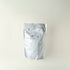 Silver foil packaging on a white background. MATCHADO Kyusyu Premium 