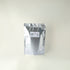 Silver foil packaging with a label on a white background