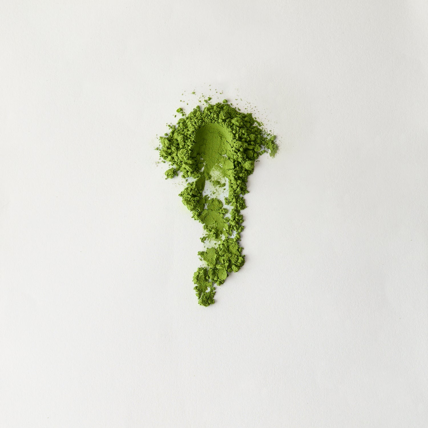 MATCHADO Organic Saemidori Matcha Premium First Flush Single Origin. Green powder in the shape of a leaf on a white background