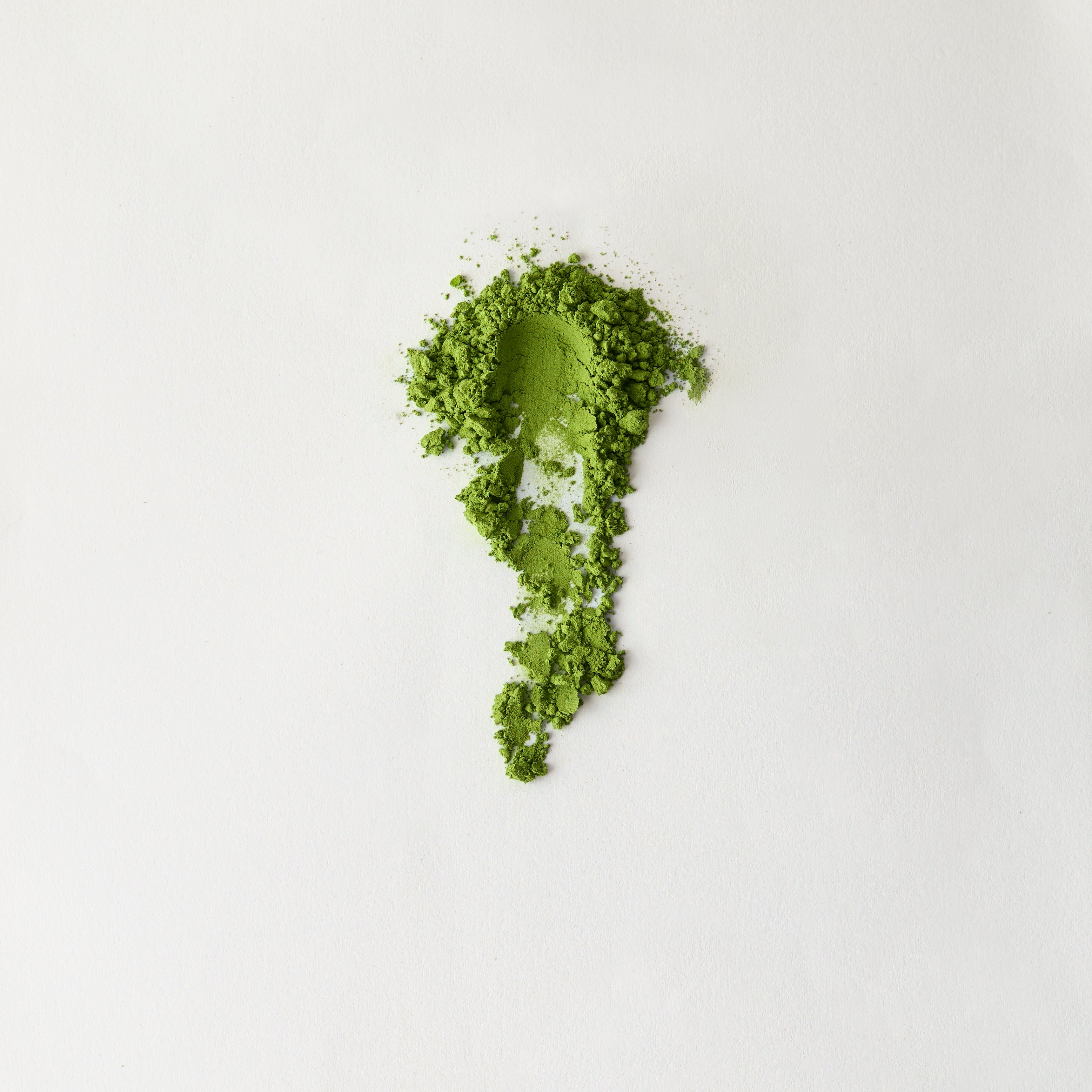 MATCHADO Organic Saemidori Matcha Premium First Flush Single Origin. Green powder in the shape of a leaf on a white background